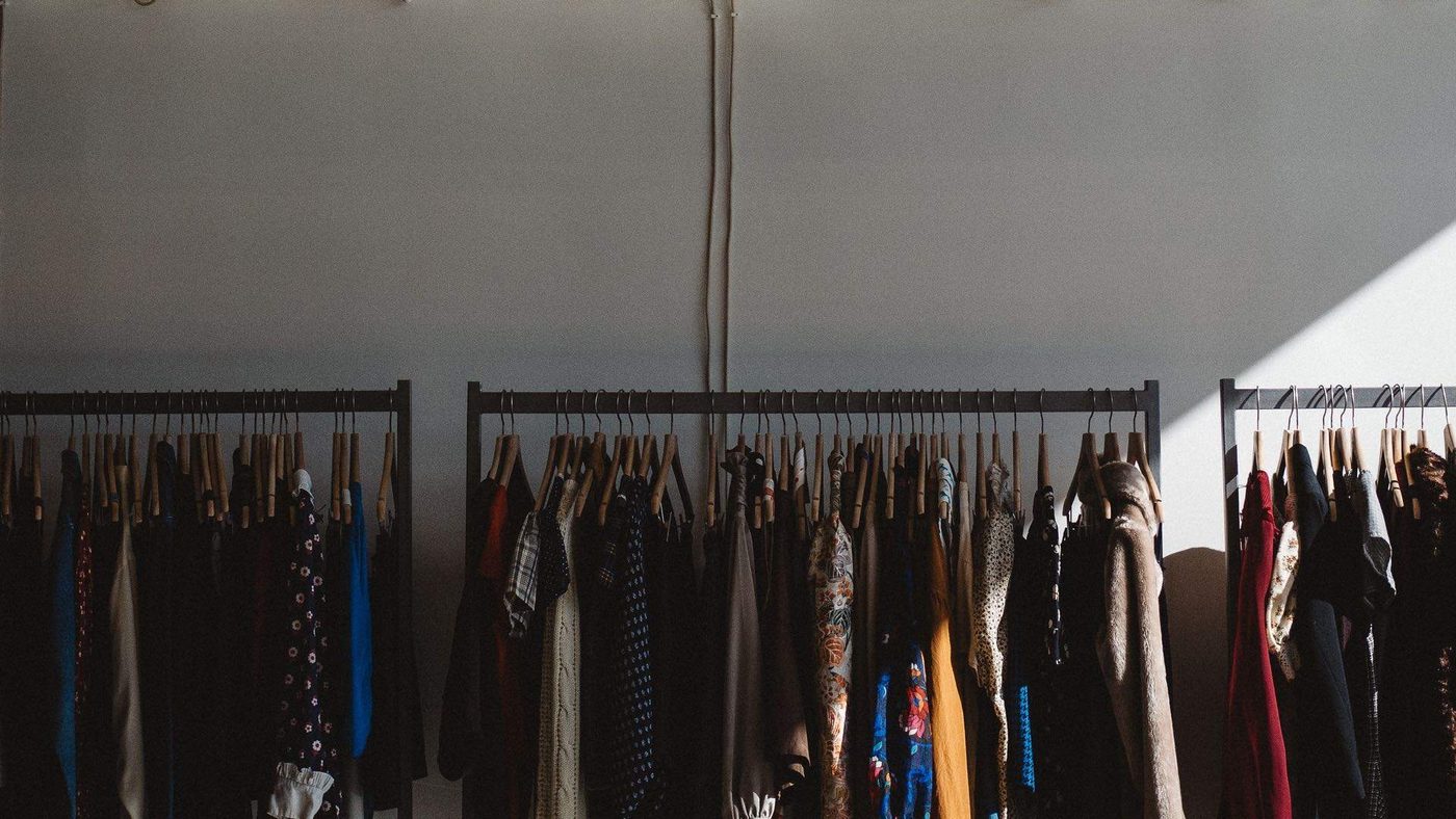 Racks of curated secondhand clothing
