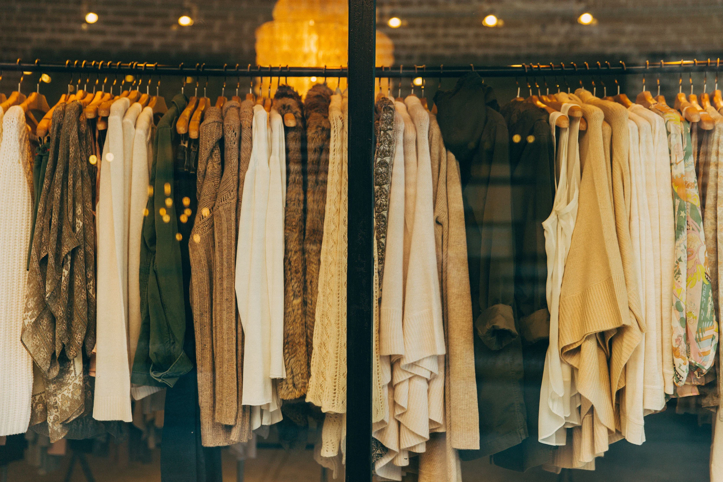 Racks of pre-loved clothing on hangers